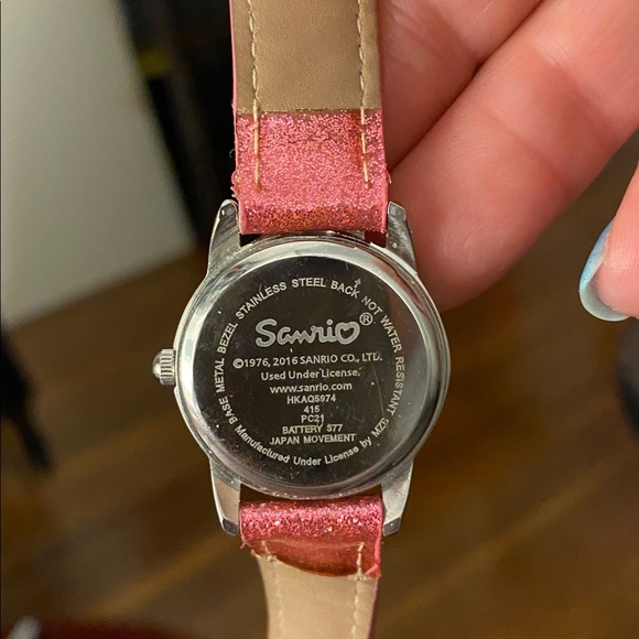 This is a Hello Kitty analog watch with a sparkly pink band and a jeweled bow - Picture 3 of 7